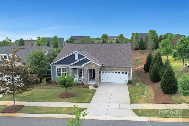 504 Gardenbrook Trl, Belmont, NC 28012 - craftsman inspired home with driveway, a front yard, a garage, stone siding, and a porch