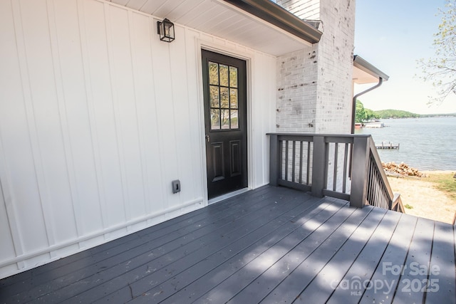 451 S Strand Dr, Norwood, NC 28128 - entrance to property featuring a deck with water view and brick siding