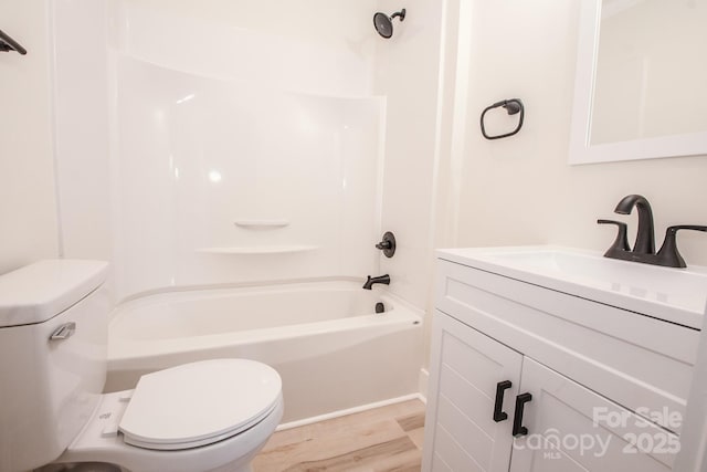 451 S Strand Dr, Norwood, NC 28128 - bathroom with shower / bathing tub combination, wood finished floors, toilet, and vanity