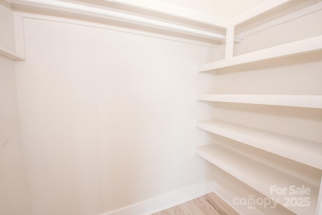 451 S Strand Dr, Norwood, NC 28128 - spacious closet with light wood-style flooring