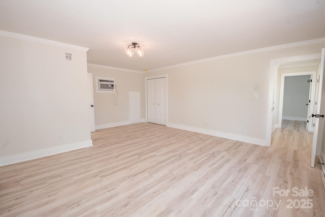 451 S Strand Dr, Norwood, NC 28128 - empty room featuring crown molding, light wood-style flooring, baseboards, and a wall mounted air conditioner