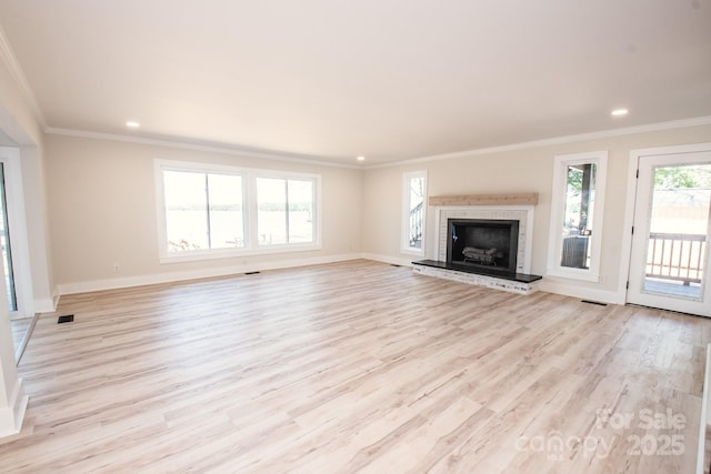 451 S Strand Dr, Norwood, NC 28128 - unfurnished living room featuring light wood finished floors, baseboards, and ornamental molding