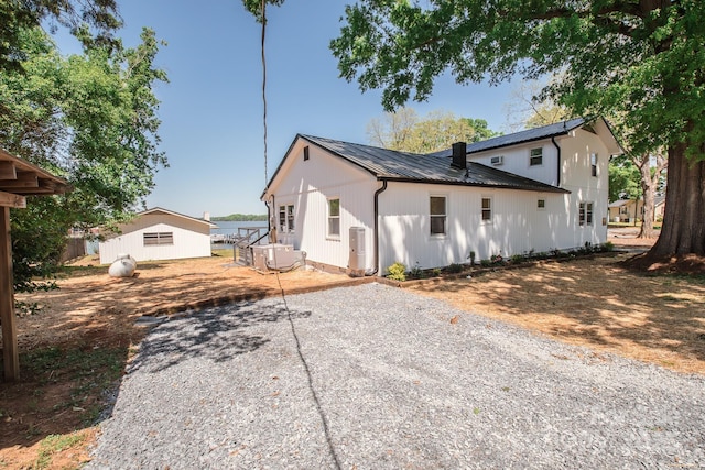 451 S Strand Dr, Norwood, NC 28128 - exterior space featuring a patio area, driveway, ac unit, and metal roof