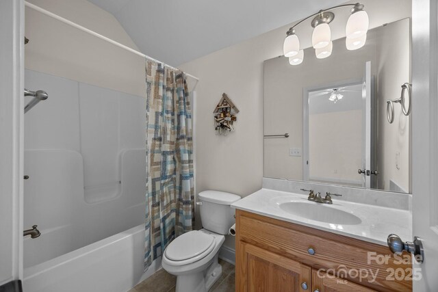 bathroom with ceiling fan, shower / bath combo, vanity, toilet, and lofted ceiling