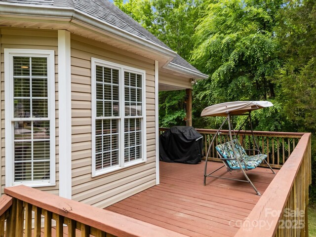 wooden terrace featuring grilling area