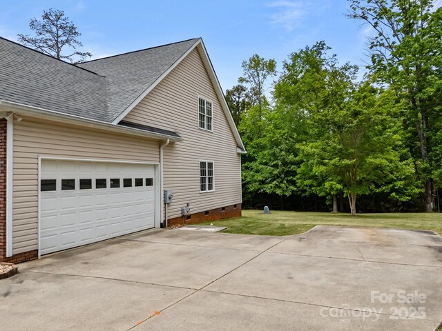 view of property exterior featuring an attached garage, a shingled roof, crawl space, concrete driveway, and a lawn