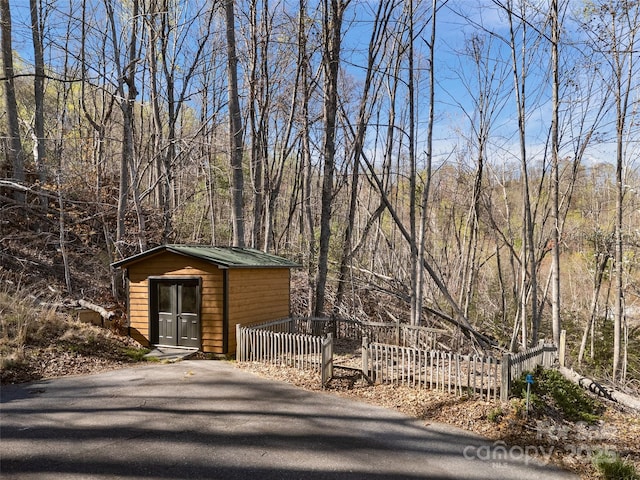 exterior space featuring a view of trees