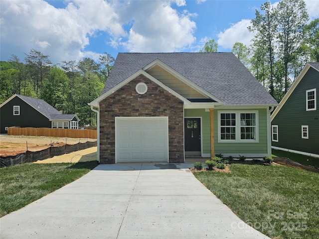 139 Brooks Cove Rd, Black Mountain, NC 28711 - view of front of property featuring concrete driveway, stone siding, a shingled roof, and a garage