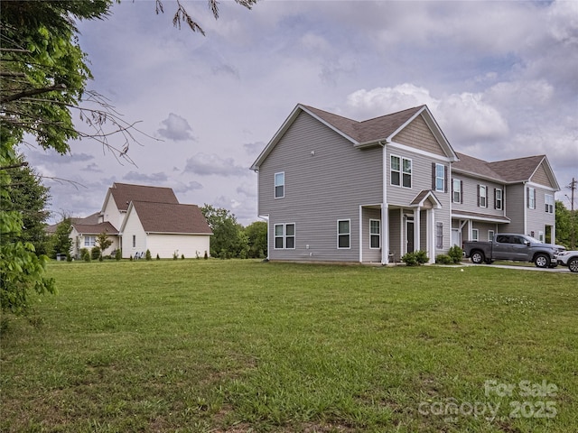14727 Choate Cir Unit 2, Charlotte, NC 28273 - view of side of property with roof with shingles and a lawn