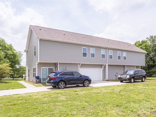 14727 Choate Cir Unit 2, Charlotte, NC 28273 - back of property with a yard, a garage, and driveway