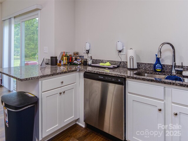 14727 Choate Cir Unit 2, Charlotte, NC 28273 - kitchen featuring a sink, a peninsula, dark stone counters, dark wood finished floors, and stainless steel dishwasher