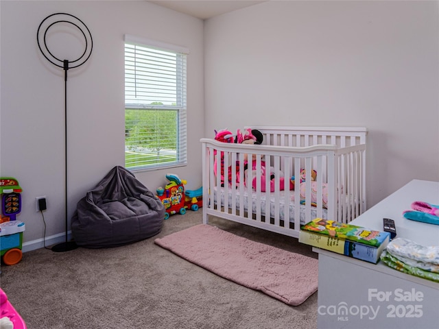 14727 Choate Cir Unit 2, Charlotte, NC 28273 - bedroom featuring multiple windows, a nursery area, and carpet