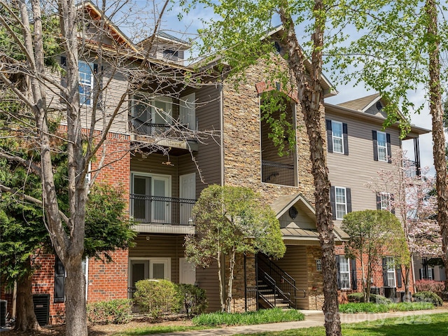 view of property featuring central AC unit