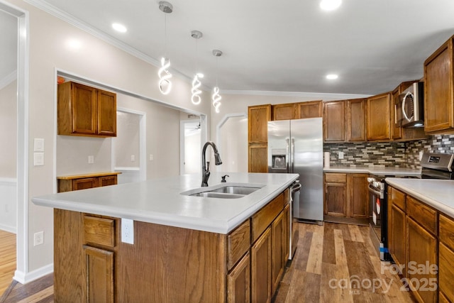 2942 Denwood Dr, Claremont, NC 28610 - kitchen with a sink, wood finished floors, brown cabinets, crown molding, and appliances with stainless steel finishes