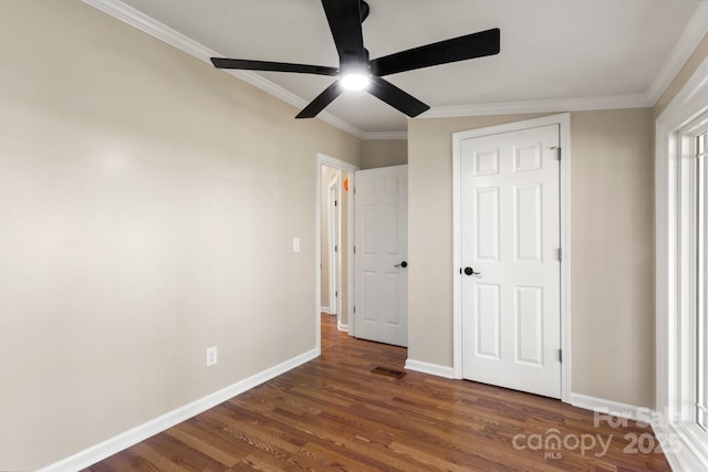 2942 Denwood Dr, Claremont, NC 28610 - unfurnished bedroom with visible vents, baseboards, a ceiling fan, wood finished floors, and ornamental molding