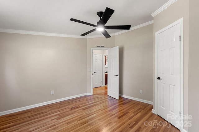 2942 Denwood Dr, Claremont, NC 28610 - unfurnished bedroom with light wood-style flooring, visible vents, baseboards, ceiling fan, and ornamental molding