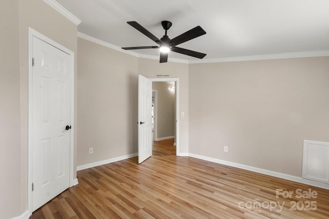 2942 Denwood Dr, Claremont, NC 28610 - unfurnished bedroom featuring a ceiling fan, baseboards, ornamental molding, and light wood-type flooring