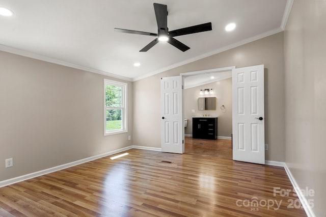 2942 Denwood Dr, Claremont, NC 28610 - unfurnished bedroom with vaulted ceiling, crown molding, wood finished floors, and recessed lighting