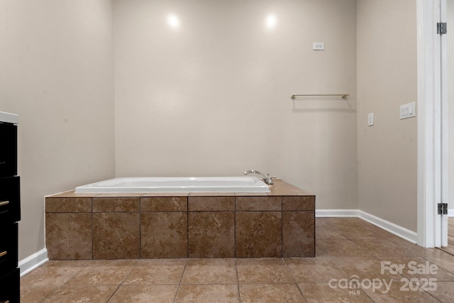 2942 Denwood Dr, Claremont, NC 28610 - full bath with a garden tub, tile patterned flooring, and baseboards