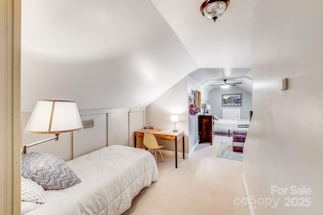 bedroom with carpet and vaulted ceiling