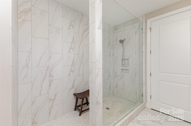 bathroom with a tile shower