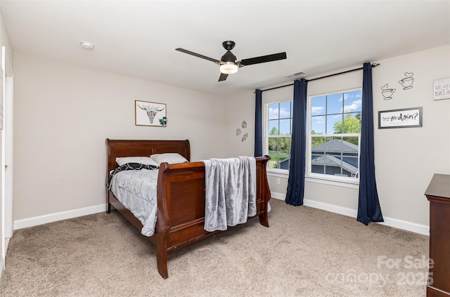bedroom with visible vents, a ceiling fan, baseboards, and carpet floors
