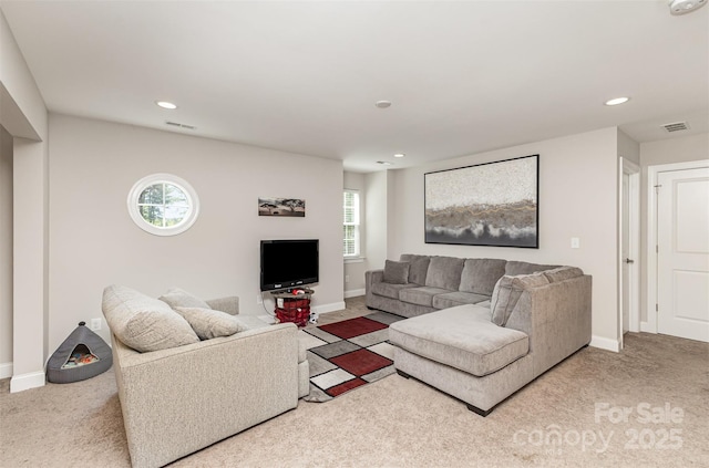 carpeted living room with baseboards, visible vents, and recessed lighting