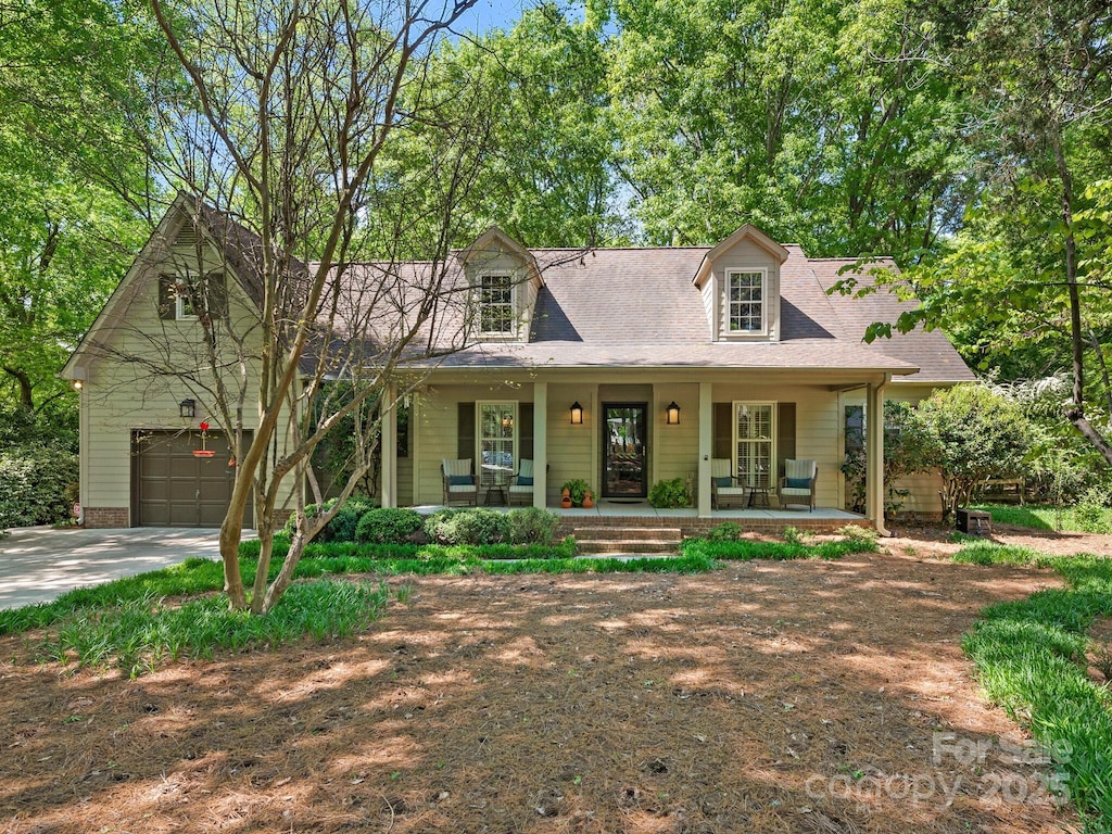 5935 Winburn Ln, Charlotte, NC 28226 - new england style home with covered porch and concrete driveway