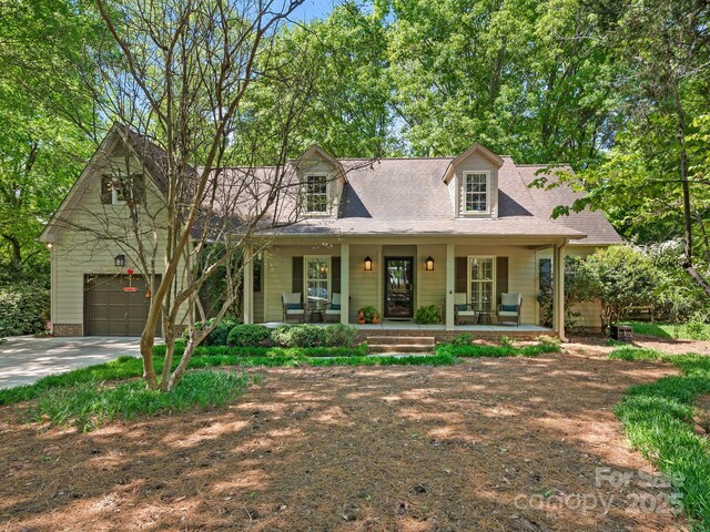 5935 Winburn Ln, Charlotte, NC 28226 - new england style home with covered porch and concrete driveway