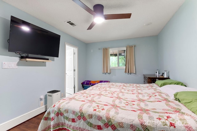 814 Columbia Dr, Chester, SC 29706 - bedroom with dark wood-style flooring, baseboards, and a ceiling fan