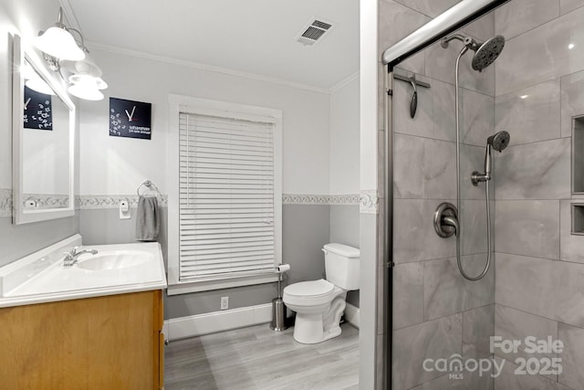 814 Columbia Dr, Chester, SC 29706 - full bathroom featuring ornamental molding, a stall shower, toilet, wood finished floors, and vanity