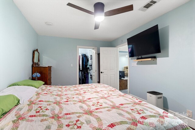 814 Columbia Dr, Chester, SC 29706 - bedroom with a walk in closet, a ceiling fan, and a closet