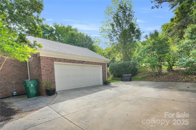 garage featuring driveway