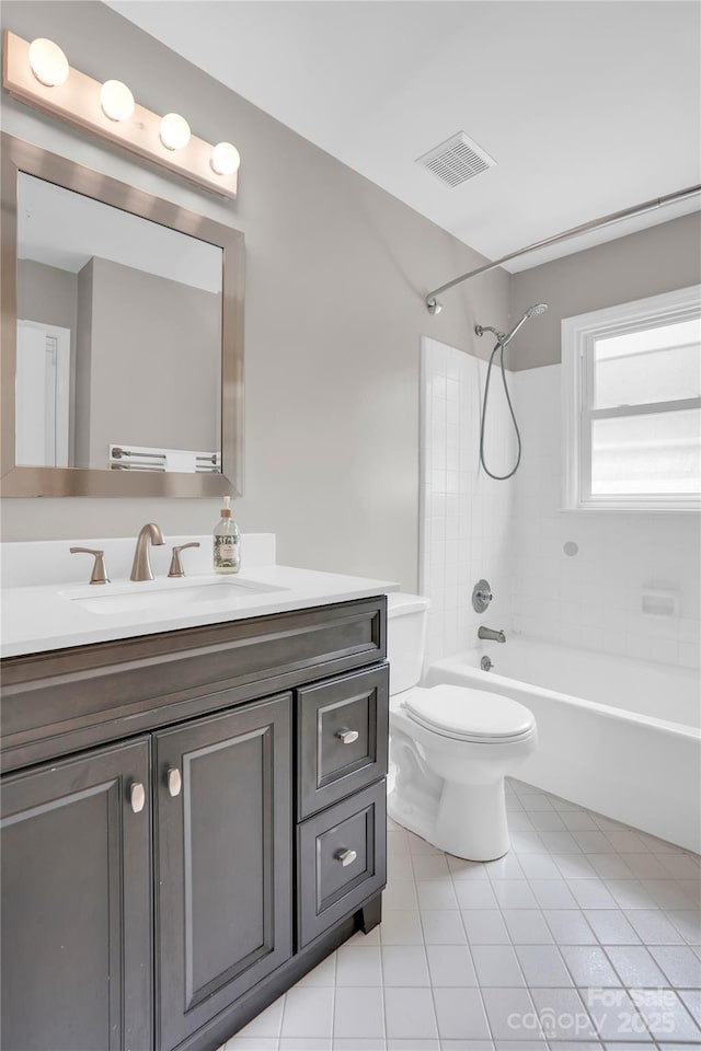 bathroom featuring tile patterned flooring, visible vents, toilet, vanity, and  shower combination