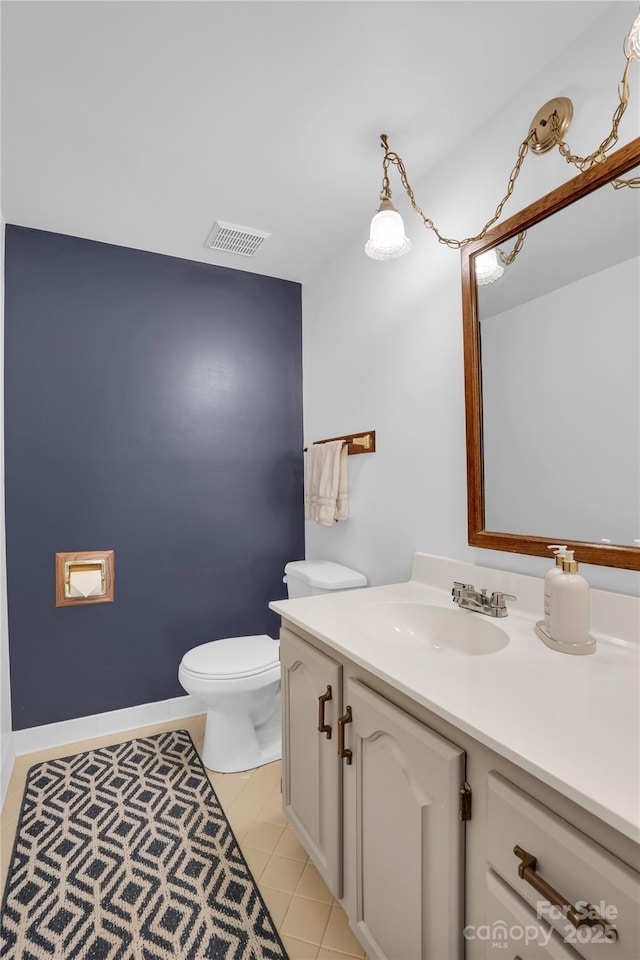 bathroom with vanity, visible vents, toilet, and tile patterned flooring