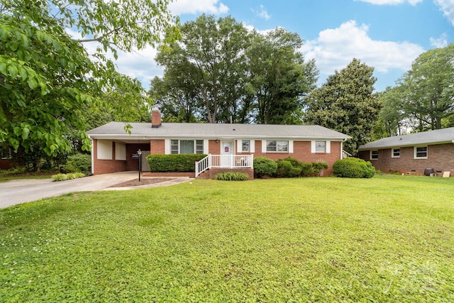 1307 Armstrong Rd, Belmont, NC 28012 - ranch-style house with driveway, brick siding, a chimney, an attached carport, and a front yard