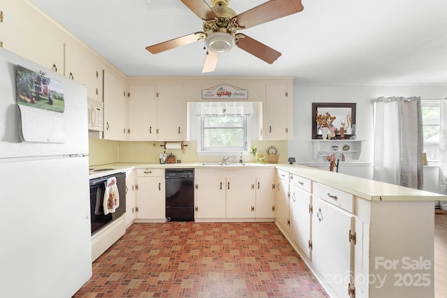 1307 Armstrong Rd, Belmont, NC 28012 - kitchen featuring white appliances, a peninsula, a sink, light countertops, and ceiling fan