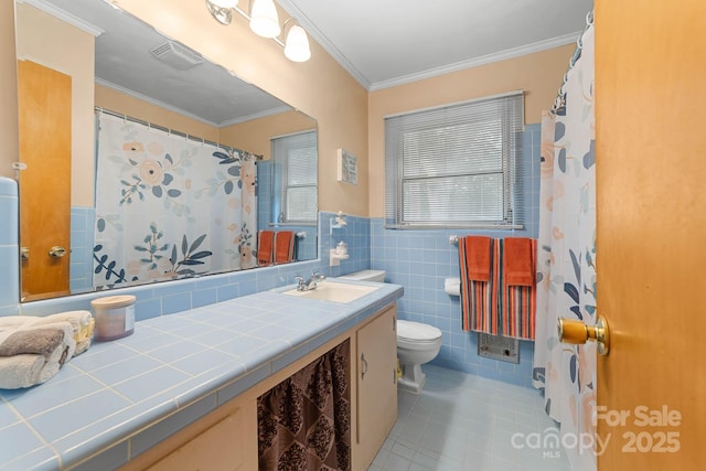 1307 Armstrong Rd, Belmont, NC 28012 - bathroom with tile patterned flooring, toilet, vanity, tile walls, and crown molding