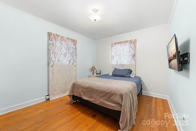 1307 Armstrong Rd, Belmont, NC 28012 - bedroom with ornamental molding, baseboards, and wood finished floors