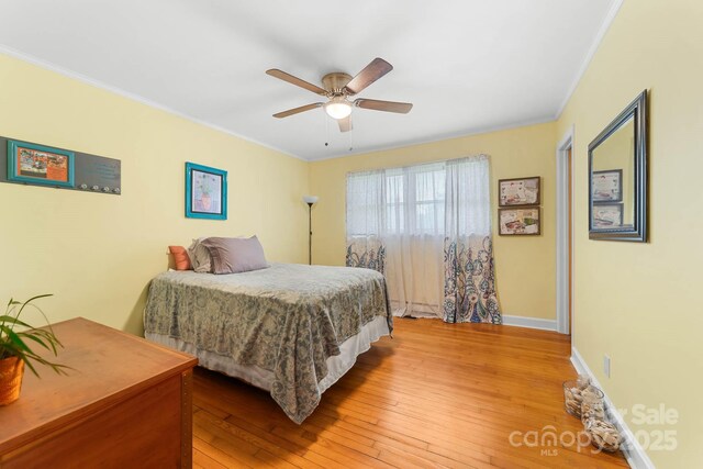 1307 Armstrong Rd, Belmont, NC 28012 - bedroom with light wood-style floors, ornamental molding, baseboards, and a ceiling fan
