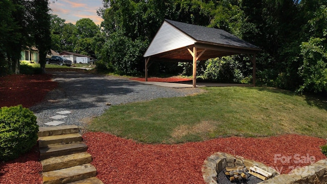 2138 Revolution Park Dr, Charlotte, NC 28208 - view of grassy yard with a carport and gravel driveway