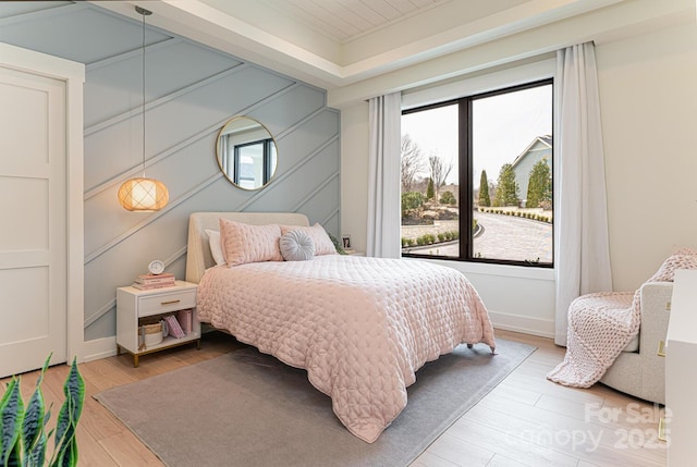 bedroom featuring light wood-style flooring