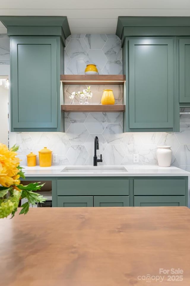 interior space with a sink and backsplash