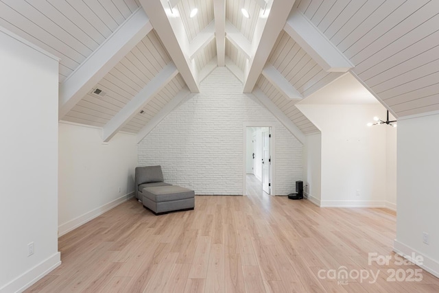 additional living space featuring baseboards, wood finished floors, vaulted ceiling with beams, and wooden ceiling