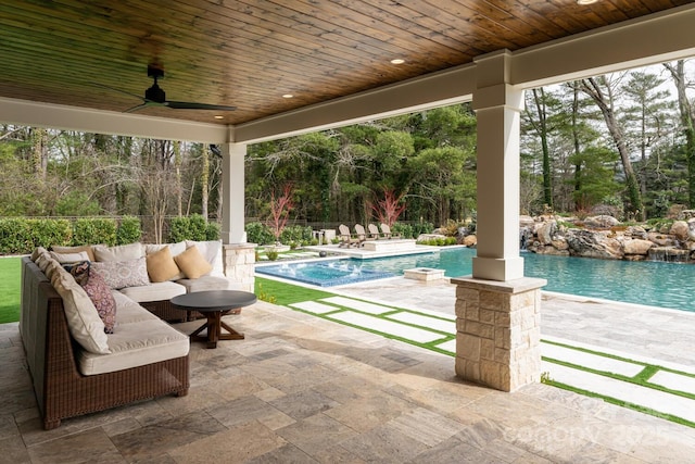 view of patio / terrace with ceiling fan, outdoor lounge area, and an outdoor pool