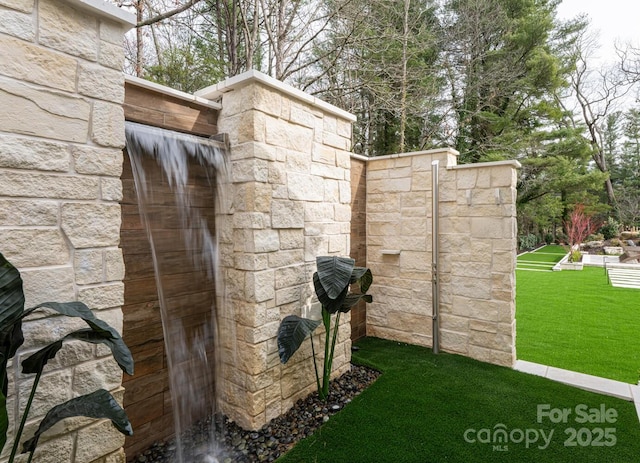 exterior space featuring stone siding