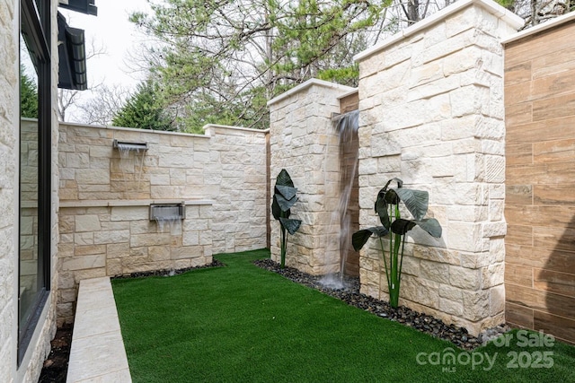 view of yard with fence