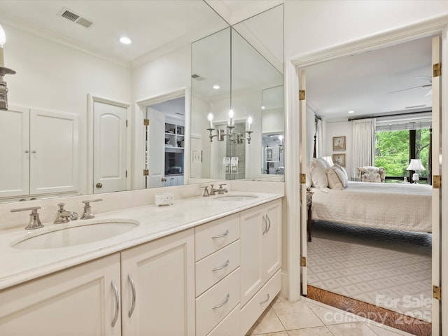 bathroom featuring visible vents, tile patterned flooring, ensuite bathroom, and a sink
