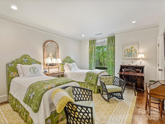 bedroom with crown molding, visible vents, and recessed lighting