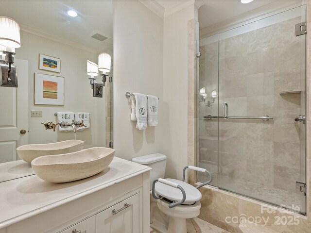 full bathroom featuring toilet, ornamental molding, vanity, and a stall shower